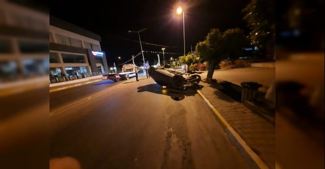 Lüks aracıyla takla attı, duvara çarptı